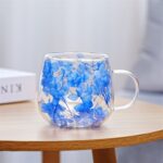 Blue dried flower filled double wall glass cup