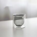 Smoke gray double wall espresso cup on white table