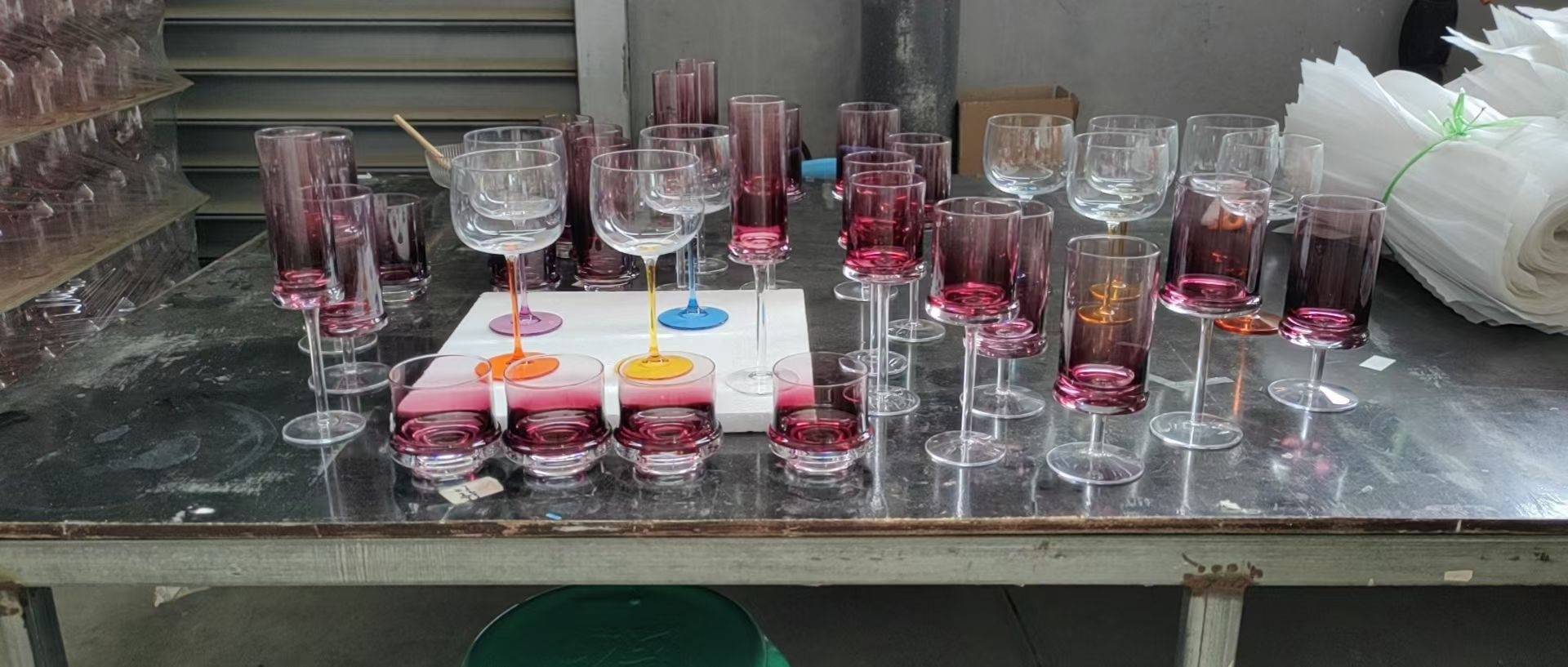 Color-sprayed crystal glassware lined up for quality check