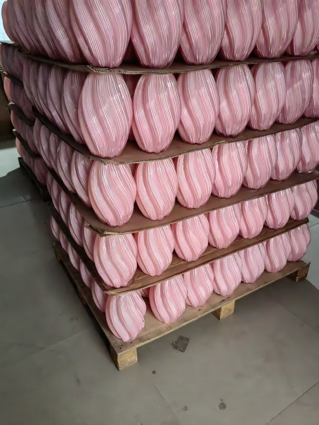 Pallet of pink handmade glass bud vases in stock, ready to ship