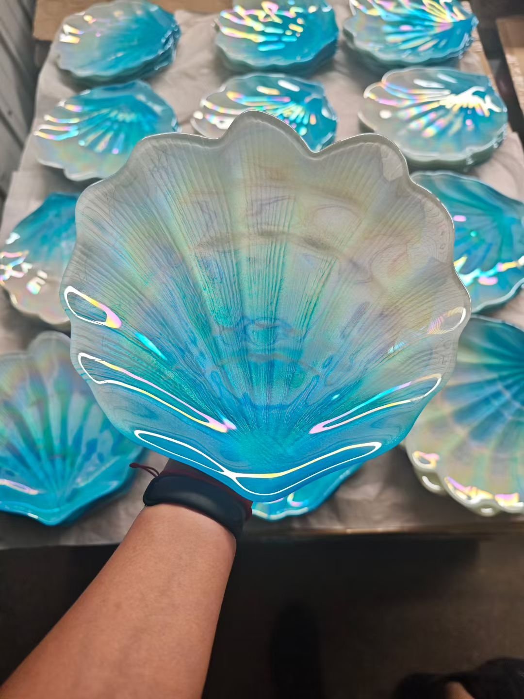 Gold rim clear glass charger plate on white linen